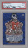 Bucky Irving from the 2024 Panini Mosaic set featuring a No Huddle Blue parallel graded by PSA and given an overall grade of 9.