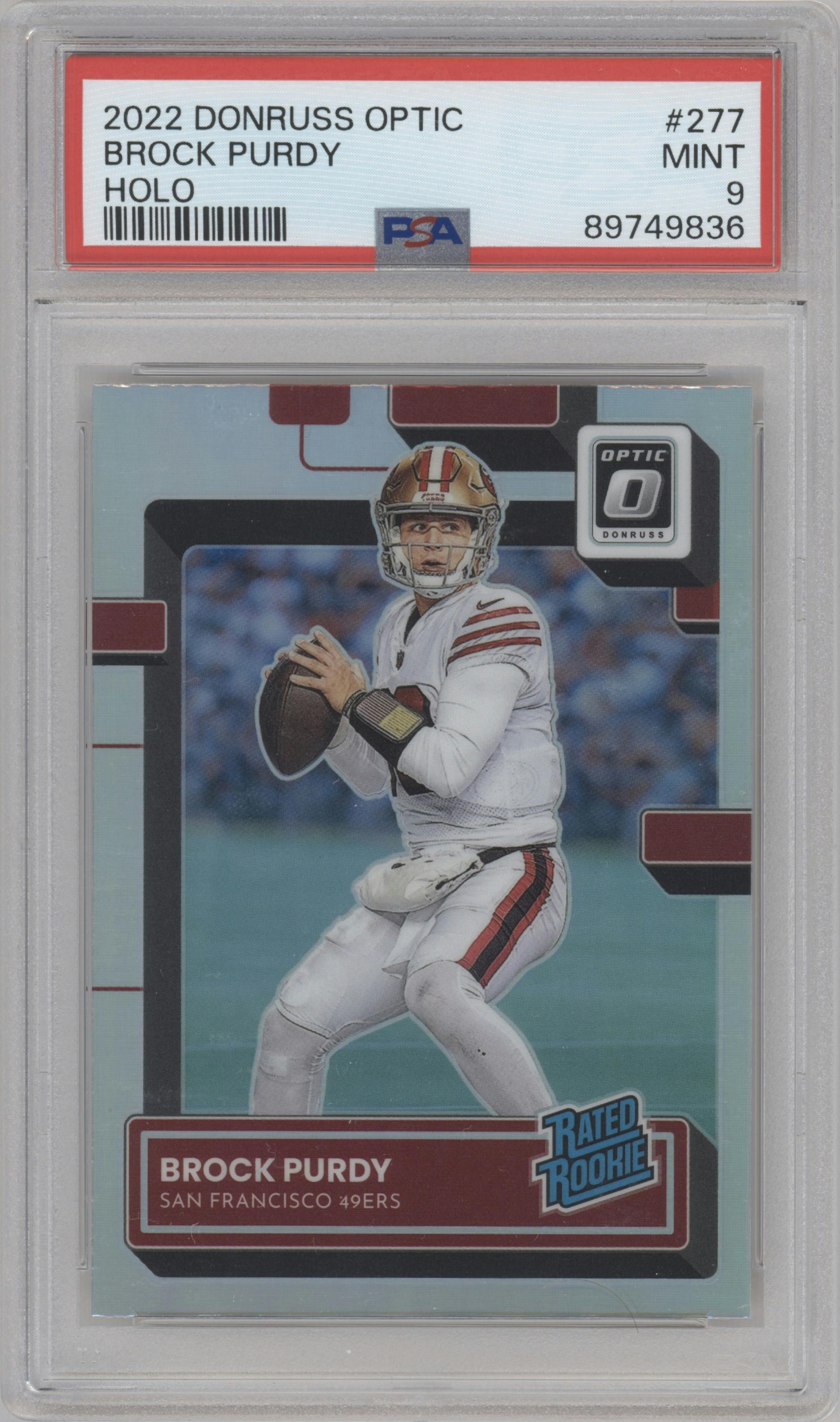 Brock Purdy from the 2022 Panini Donruss Optic set featuring a Holo parallel graded by PSA and given an overall grade of 9.