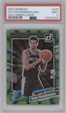 Victor Wembanyama from the 2023-24 Panini Donruss set featuring a Green Holo Laser  parallel graded by PSA and given an overall grade of 9.