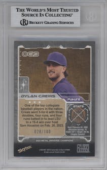 Dylan Crews from the 2023 Skybox Metal Universe Champions set featuring a Red Precious Metal Gems parallel graded by Beckett and given an overall grade of 8.5.