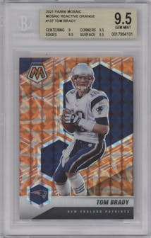 Tom Brady from the 2021 Panini Mosaic set featuring a Reactive Orange parallel graded by Beckett and given an overall grade of 9.5.