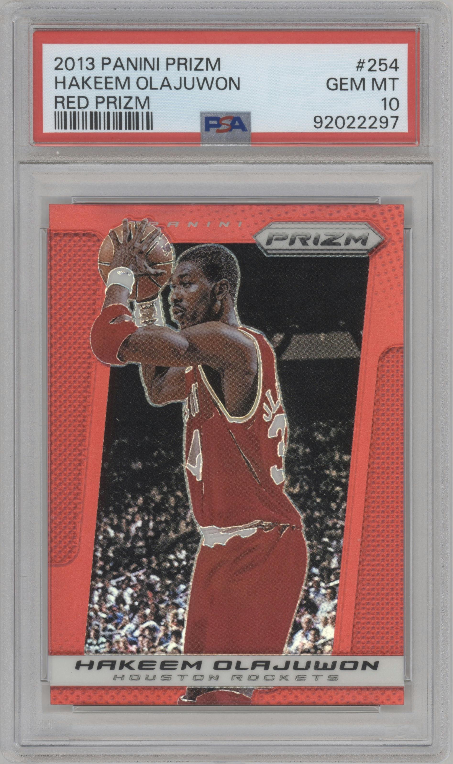 Hakeem Olajuwon from the 2013-14 Panini Prizm set featuring a Red Prizm parallel graded by PSA and given an overall grade of 10.