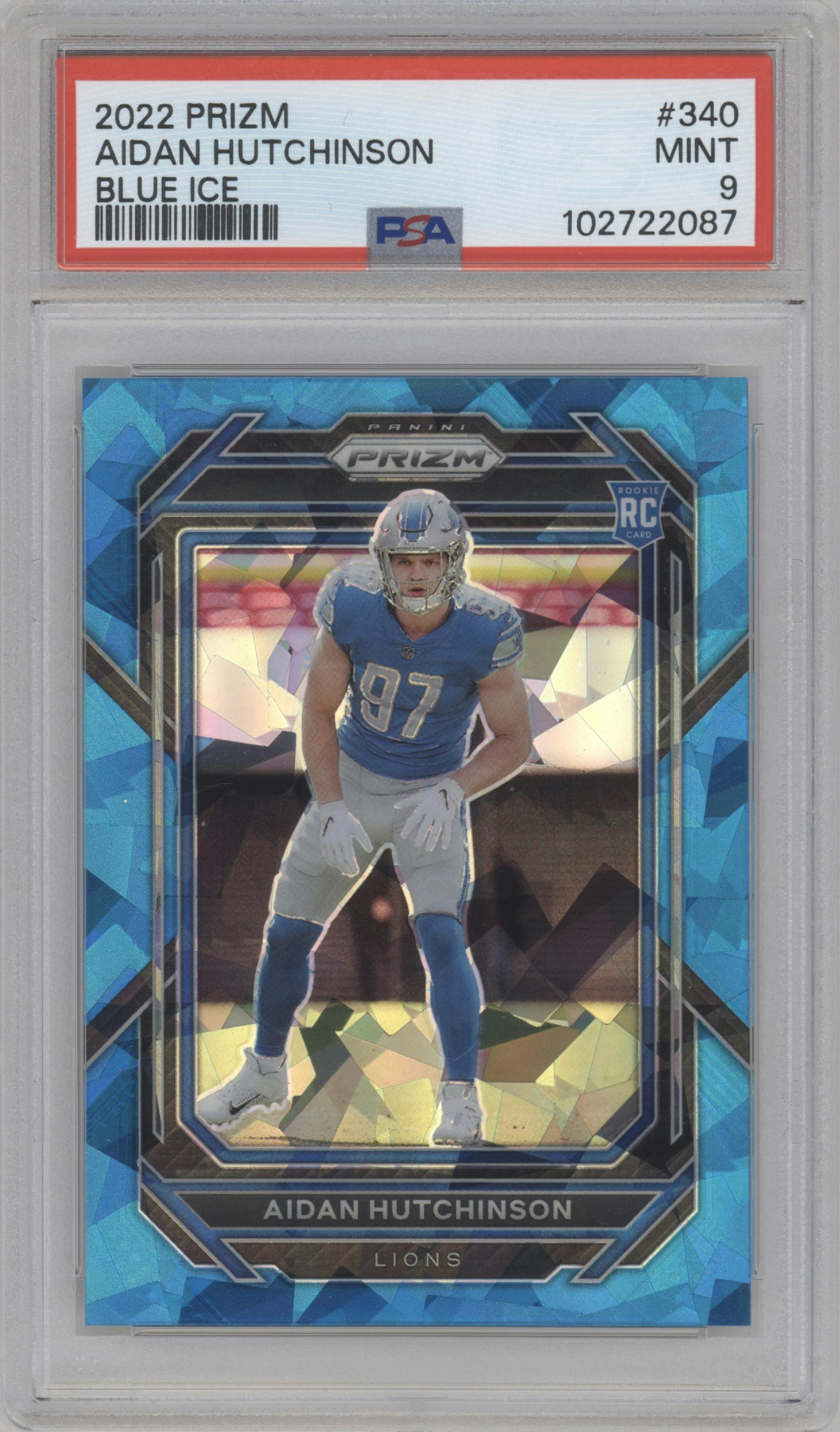 Aidan Hutchinson from the 2022 Panini Prizm set featuring a Blue Ice parallel graded by PSA and given an overall grade of 9.