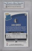 Luka Doncic from the 2018-19 Panini Donruss Optic set featuring a Shock parallel graded by Beckett and given an overall grade of 8.5.