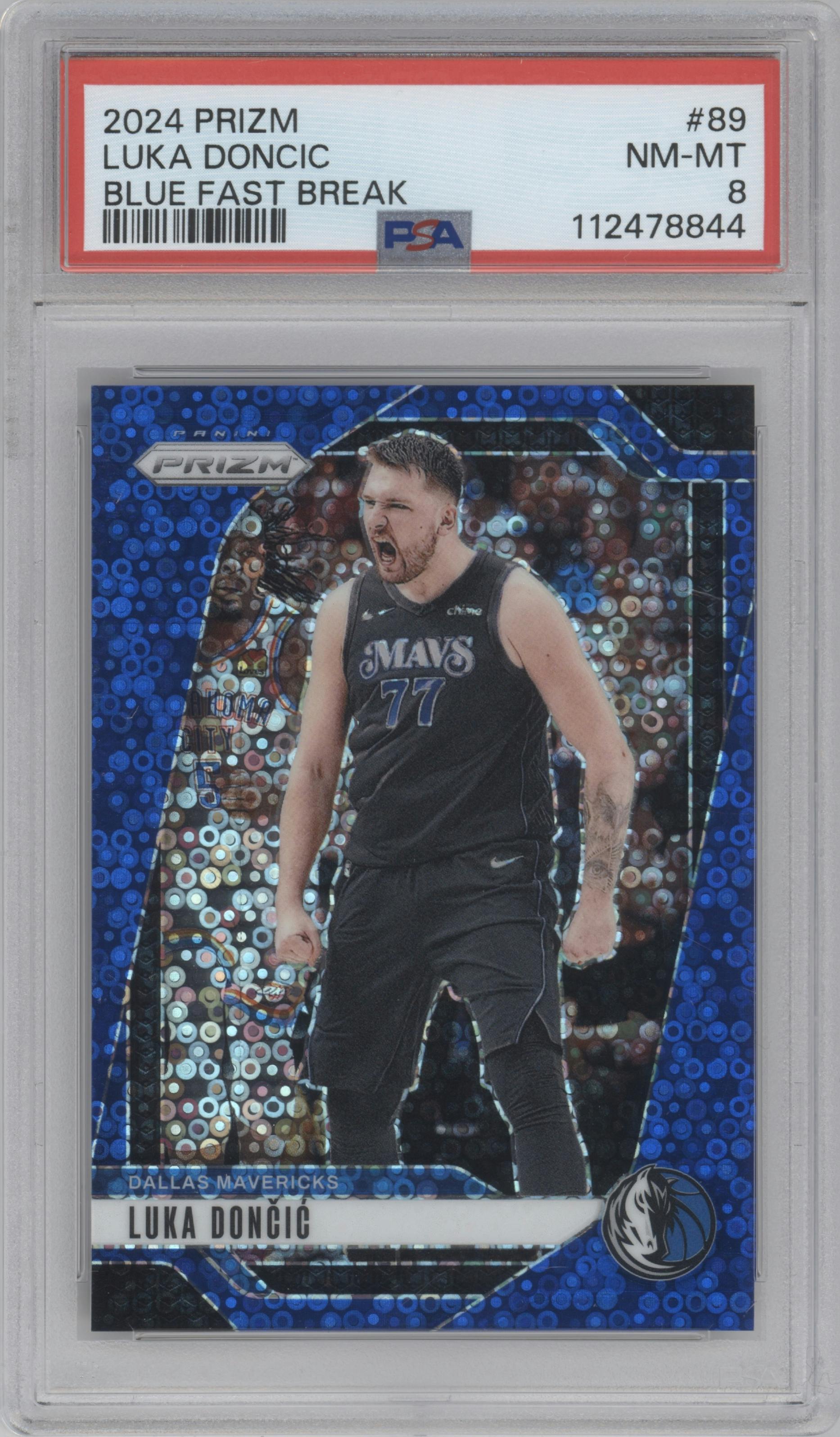 Luka Doncic from the 2024-25 Panini Prizm set featuring a Fast Break Blue parallel graded by PSA and given an overall grade of 8.