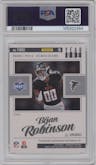 Bijan Robinson from the 2023 Panini Luminance set featuring a Red parallel graded by PSA and given an overall grade of 9.