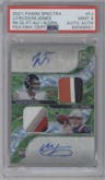 Justin Fields/Mac Jones from the 2021 Panini Spectra set featuring a Neon Green parallel graded by PSA and given an overall grade of 9.