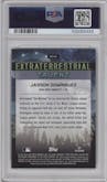 Jasson Dominguez from the 2024 Topps Cosmic Chrome set featuring a Green Space Dust Refractor parallel graded by PSA and given an overall grade of 9.