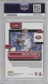 Brock Purdy from the 2022 Panini Donruss Optic set featuring a Holo parallel graded by PSA and given an overall grade of 9.