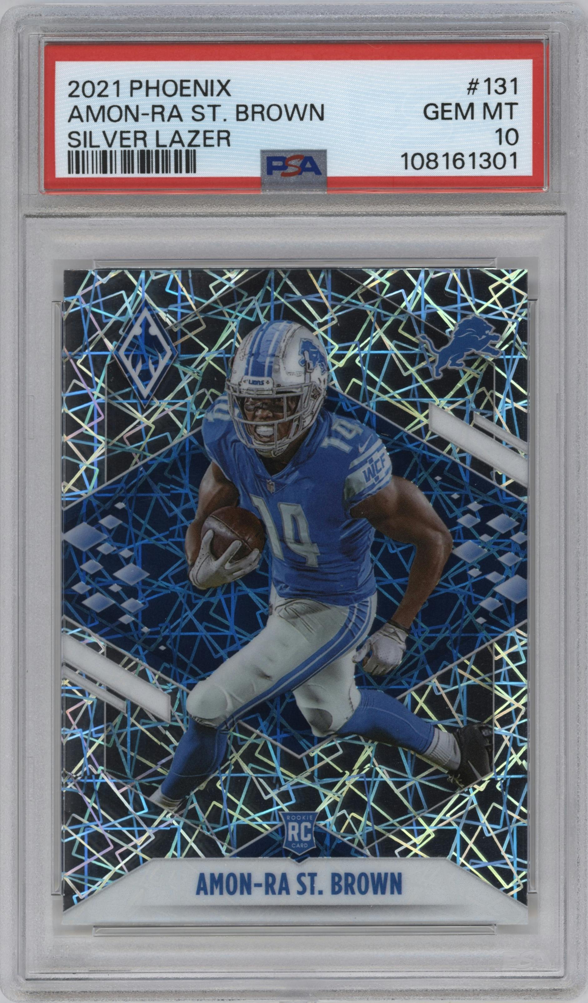 Amon-Ra St. Brown from the 2021 Panini Phoenix set featuring a Silver Lazer parallel graded by PSA and given an overall grade of 10.