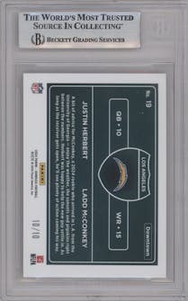 Justin Herbert/Ladd McConkey from the 2024 Donruss set featuring a Gold parallel graded by Beckett and given an overall grade of 9.