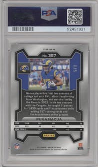 Puka Nacua from the 2023 Panini Prizm set featuring a Red/Yellow Prizm parallel graded by PSA and given an overall grade of 9.