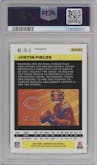 Justin Fields from the 2021 Panini Chronicles set featuring a Green parallel graded by PSA and given an overall grade of 10.