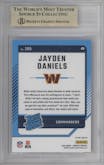 Jayden Daniels from the 2024 Donruss set featuring a Red Pandora parallel graded by Beckett and given an overall grade of 9.5.