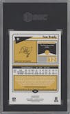 Tom Brady from the 2022 Panini Classics set featuring a Timeless Tributes Gold parallel graded by SGC and given an overall grade of 9.5.