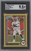 Tom Brady from the 2022 Panini Classics set featuring a Timeless Tributes Gold parallel graded by SGC and given an overall grade of 9.5.