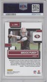 Brock Purdy from the 2022 Panini Donruss set featuring a Press Proof Premium parallel graded by PSA and given an overall grade of 10.