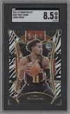 Trae Young from the 2023-24 Panini Select  set featuring a Zebra Prizm parallel graded by SGC and given an overall grade of 8.5.