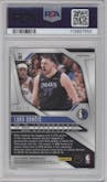 Luka Doncic from the 2024-25 Panini Prizm set featuring a Choice Cherry Blossom parallel graded by PSA and given an overall grade of 8.