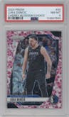 Luka Doncic from the 2024-25 Panini Prizm set featuring a Choice Cherry Blossom parallel graded by PSA and given an overall grade of 8.