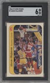 Akeem Olajuwon from the 1986-87 Fleer set graded by SGC and given an overall grade of 6.