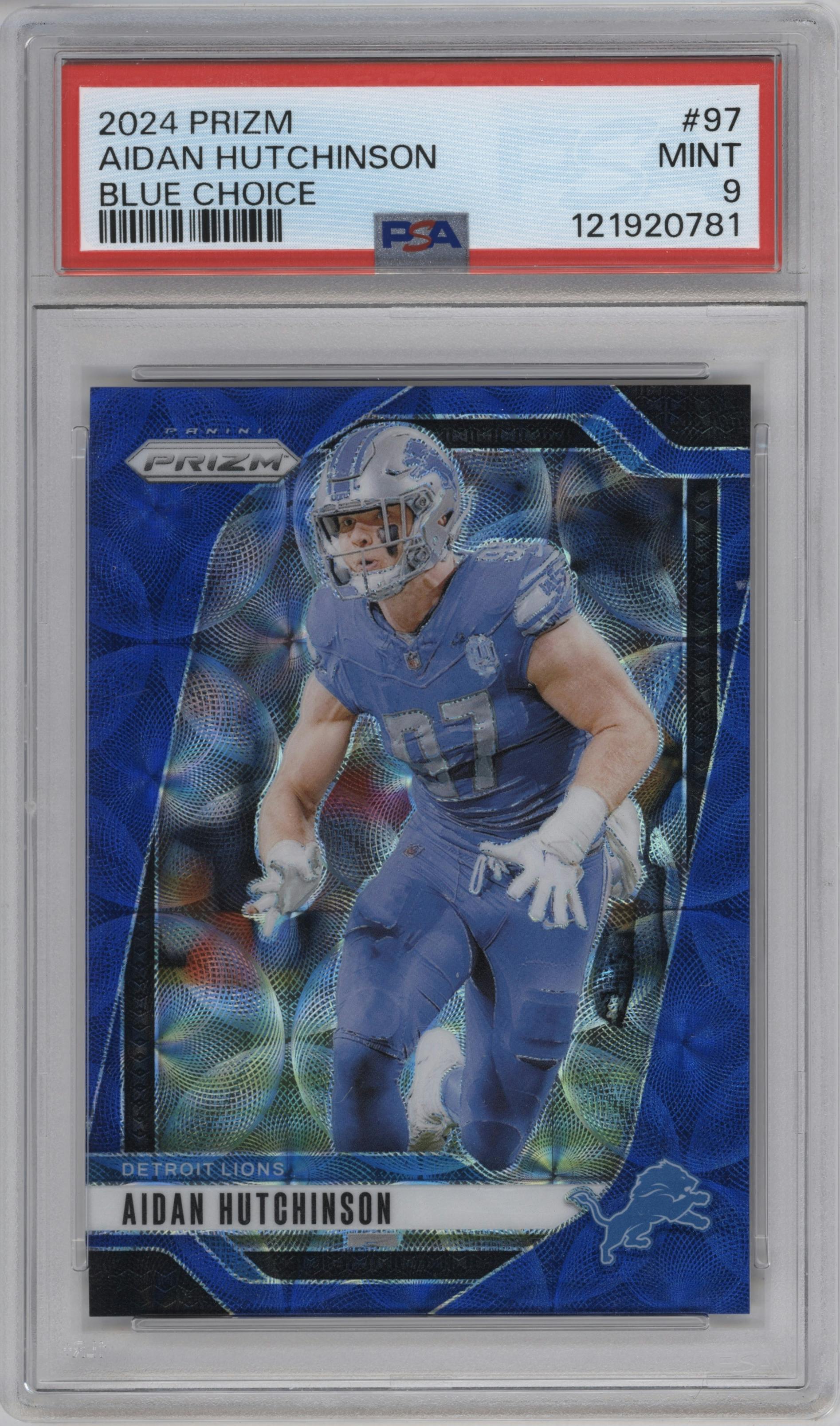 Aidan Hutchinson from the 2024 Panini Prizm set featuring a Choice Blue parallel graded by PSA and given an overall grade of 9.