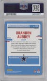 Brandon Aubrey from the 2023 Donruss Optic set featuring a Holo parallel graded by PSA and given an overall grade of 10.