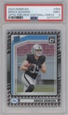 Brock Bowers from the 2024 Donruss set featuring a Football Emoji parallel graded by PSA and given an overall grade of 9.