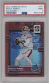 Brock Purdy from the 2022 Panini Donruss Optic set featuring a Hyper Red parallel graded by PSA and given an overall grade of 9.