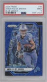 Amon-Ra St. Brown  from the 2024 Panini Prizm set featuring a Choice Blue parallel graded by PSA and given an overall grade of 9.