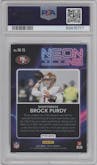 Brock Purdy from the 2022 Panini Select set featuring a Silver Prizm parallel graded by PSA and given an overall grade of 10.