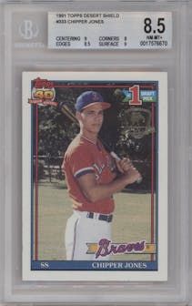 Chipper Jones from the 1991 Topps set featuring a Desert Shield parallel graded by Beckett and given an overall grade of 8.5.