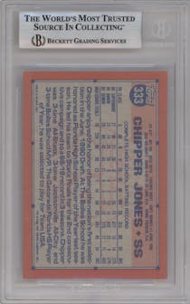Chipper Jones from the 1991 Topps set featuring a Desert Shield parallel graded by Beckett and given an overall grade of 8.5.