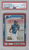 Brian Thomas Jr. from the 2024 Donruss set featuring a Red Wave parallel graded by PSA and given an overall grade of 10.