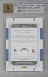Justin Herbert from the 2020 Panini National Treasures set featuring a Tag parallel graded by Beckett and given an overall grade of 8.5.