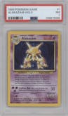 Alakazam from the 1999 Pokemon set graded by PSA and given an overall grade of 7.
