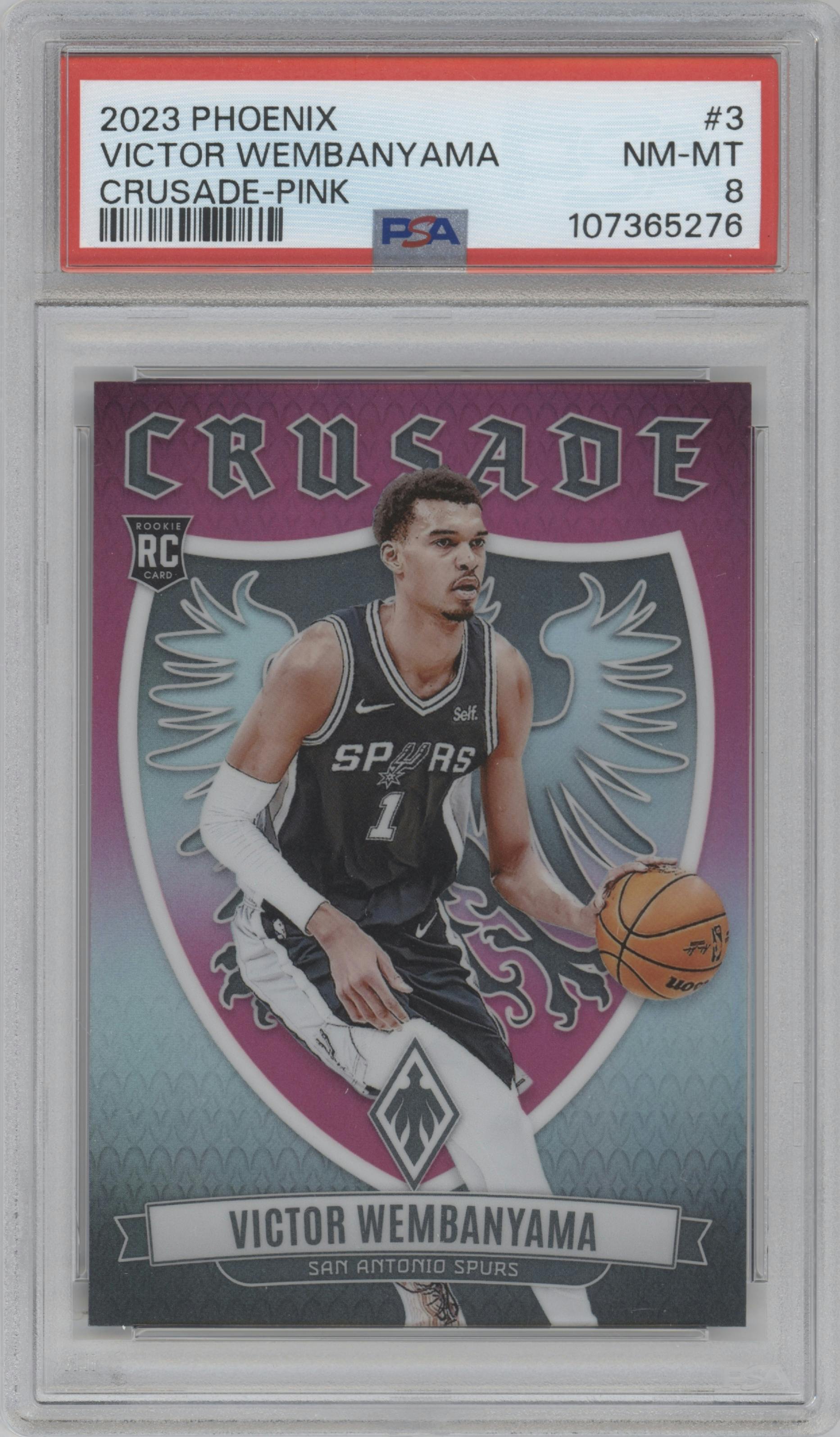 Victor Wembanyama from the 2023-24 Panini Phoenix set featuring a Pink parallel graded by PSA and given an overall grade of 8.