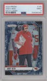 Andy Reid from the 2024 Panini Prizm set featuring a Navy Camo parallel graded by PSA and given an overall grade of 9.
