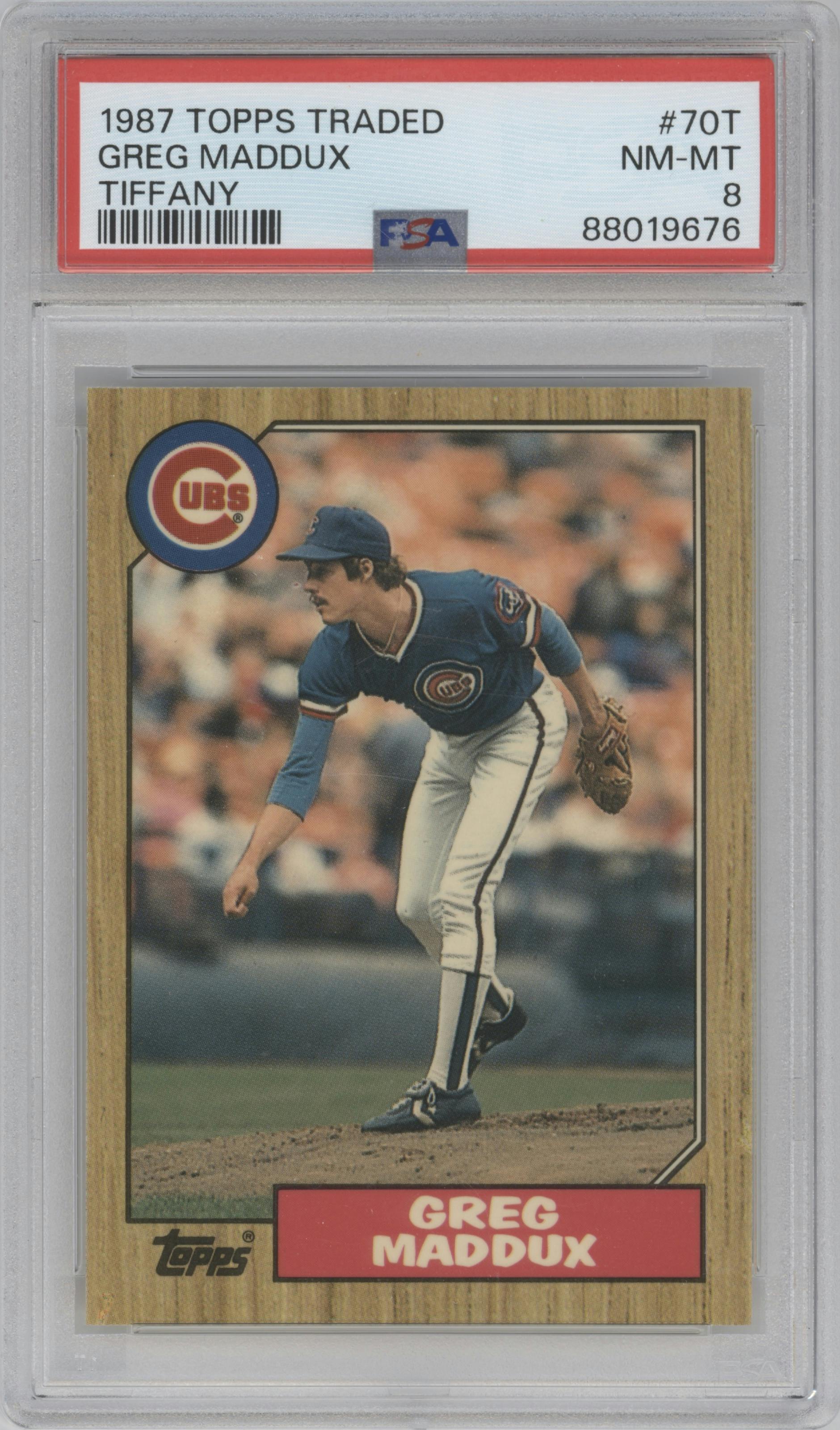 Greg Maddux from the 1987 Topps Traded set featuring a Tiffany parallel graded by PSA and given an overall grade of 8.