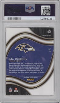 J.K. Dobbins from the 2020 Panini Select set featuring a Neon Orange Pulsar parallel graded by PSA and given an overall grade of 9.