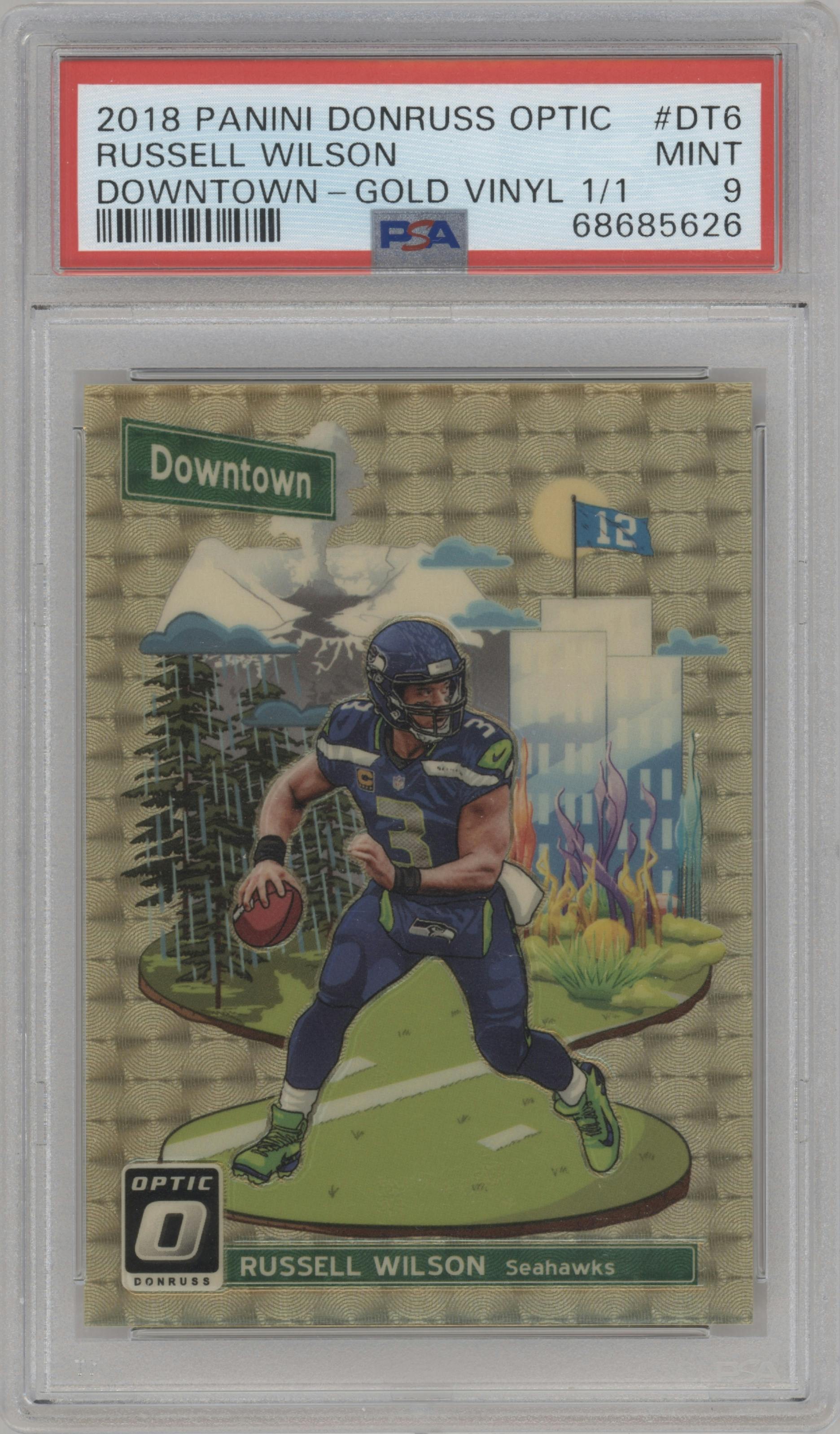 Russell Wilson from the 2018 Panini Donruss Optic set featuring a Gold Vinyl parallel graded by PSA and given an overall grade of 9.