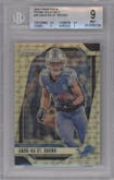 Amon-Ra St. Brown  from the 2024 Panini Prizm set featuring a Gold Vinyl parallel graded by Beckett and given an overall grade of 9.