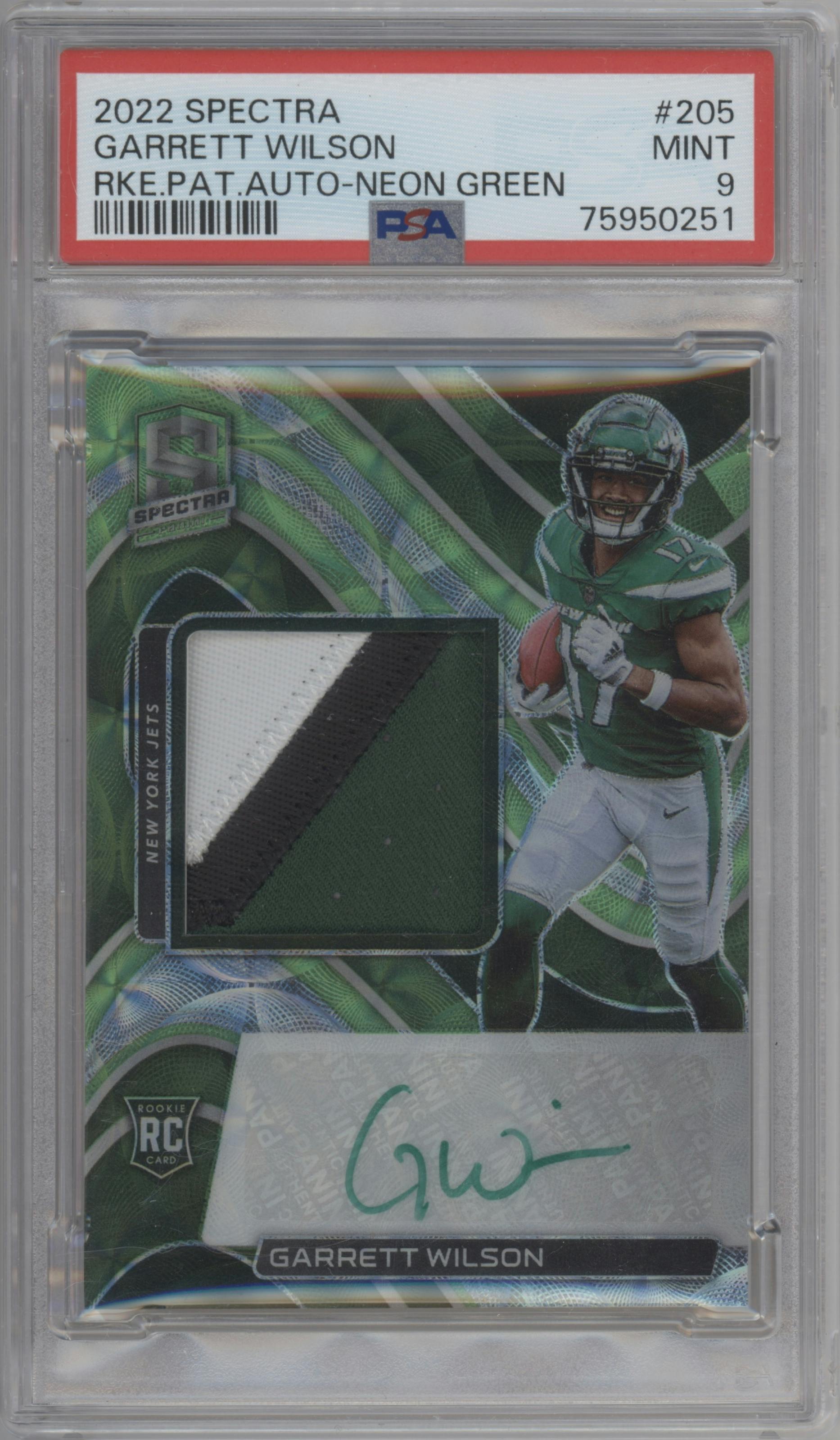 Garrett Wilson from the 2022 Panini Spectra set featuring a Neon Green parallel graded by PSA and given an overall grade of 9.