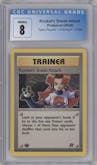 Rocket's Sneak Attack from the 2000 Pokemon set graded by CSG and given an overall grade of 8.