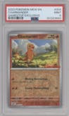 Charmander from the 2023 Pokemon SV set featuring a GameStop Exclusive parallel graded by PSA and given an overall grade of 9.