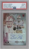 Brock Purdy from the 2022 Panini Illusions set featuring a Red parallel graded by PSA and given an overall grade of 9.