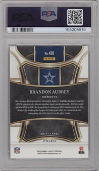 Brandon Aubrey from the 2023 Panini Select set featuring a Dragon Scale parallel graded by PSA and given an overall grade of 10.