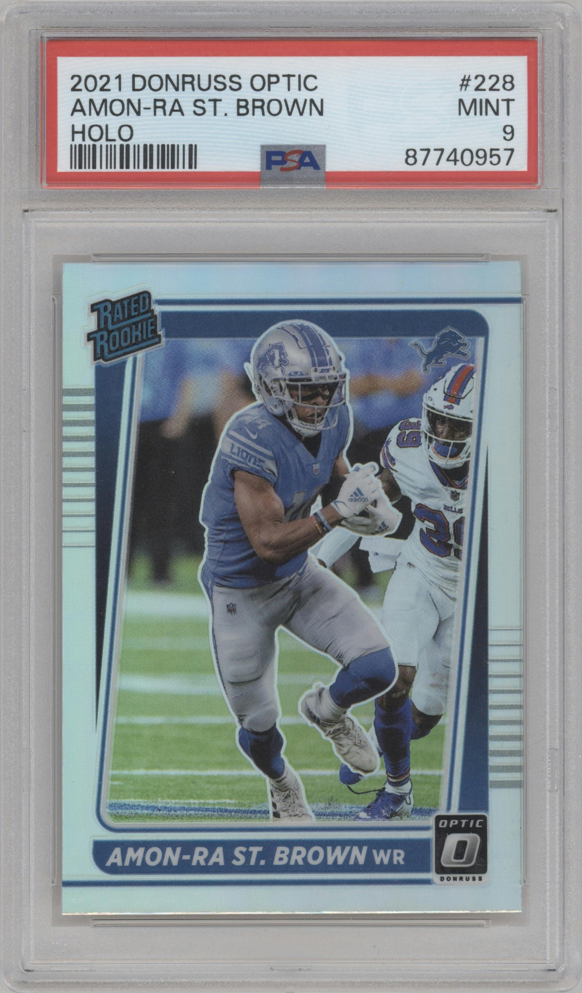 Amon-Ra St. Brown from the 2021 Panini Donruss Optic set featuring a Holo parallel graded by PSA and given an overall grade of 9.