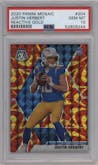 Justin Herbert from the 2020 Panini Mosaic set featuring a Reactive Gold parallel graded by PSA and given an overall grade of 10.