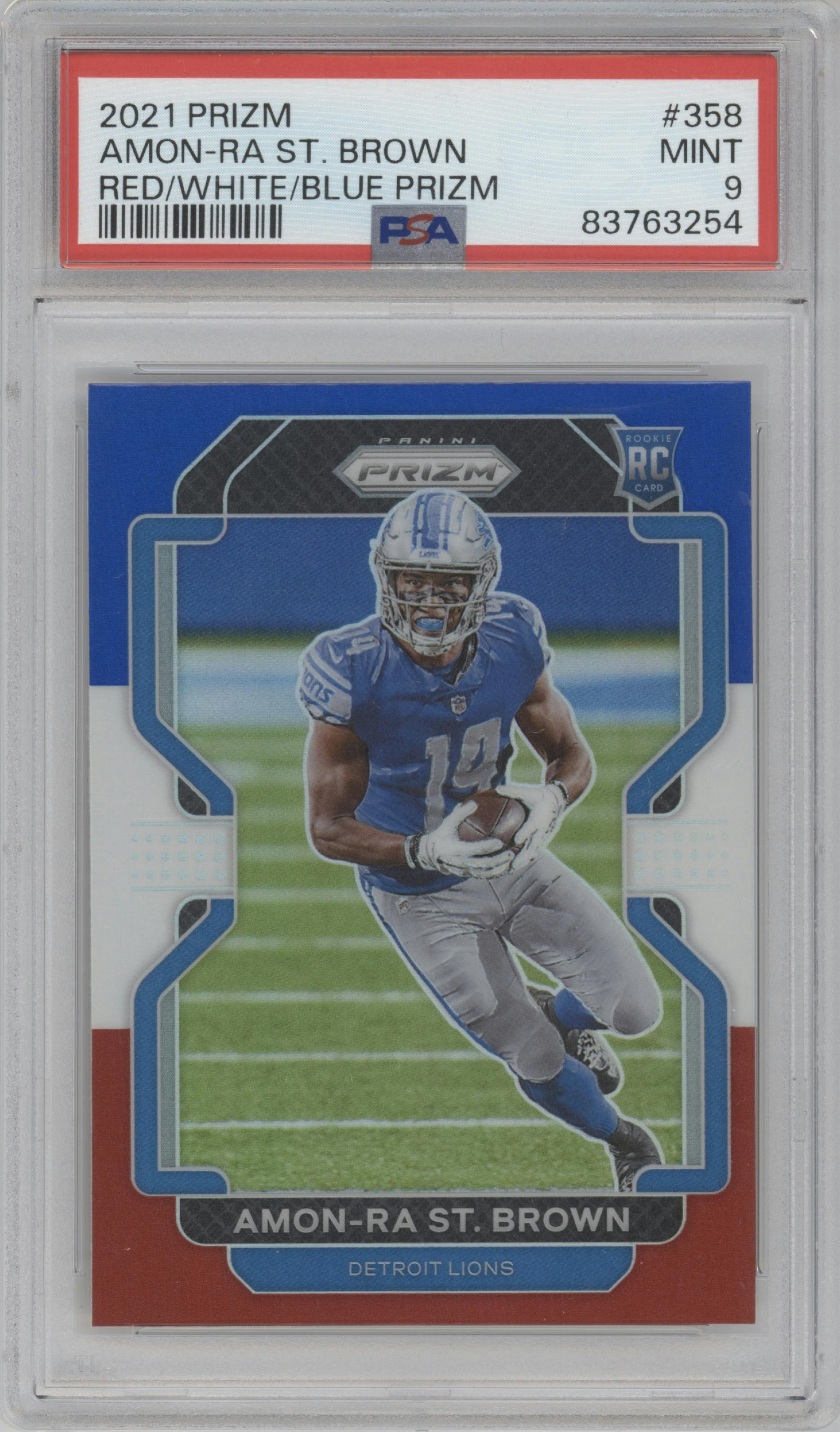 Amon-Ra St. Brown from the 2021 Panini Prizm set featuring a Red/White/Blue Prizm parallel graded by PSA and given an overall grade of 9.